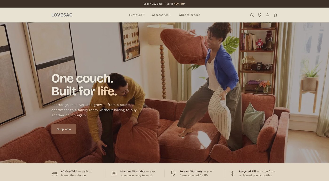 Redesigned Lovesac homepage hero: real lifestyle photograph, single headline, simplified navigation, and a trust-signal bar.